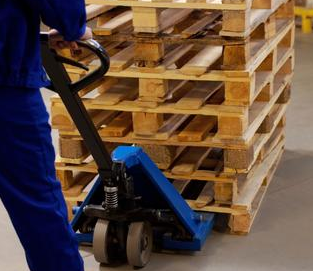 Factory relocation using manual forklifts to transport goods